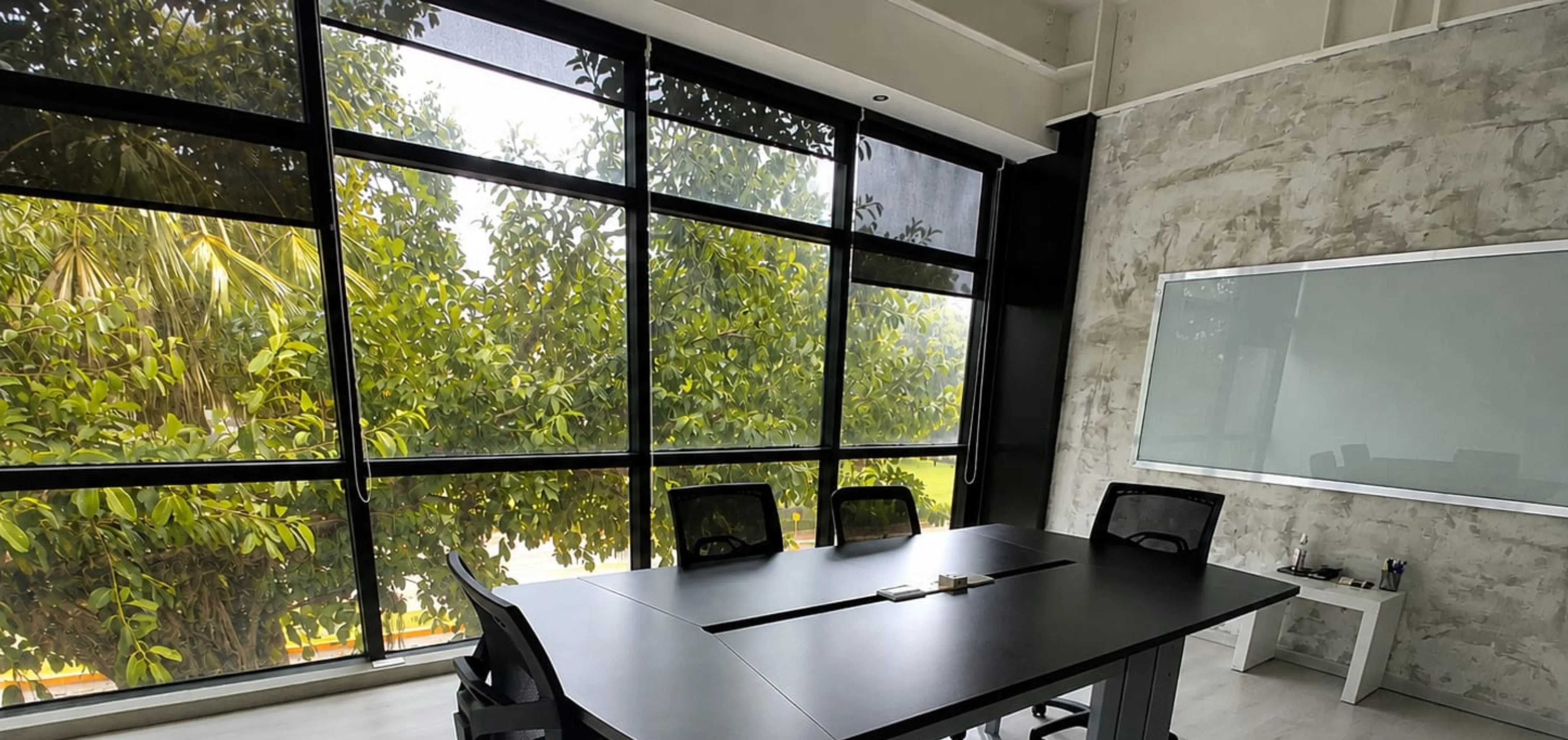 Meeting room with windows and whiteboard at Plaza Altum, Ciudad del Carmen
